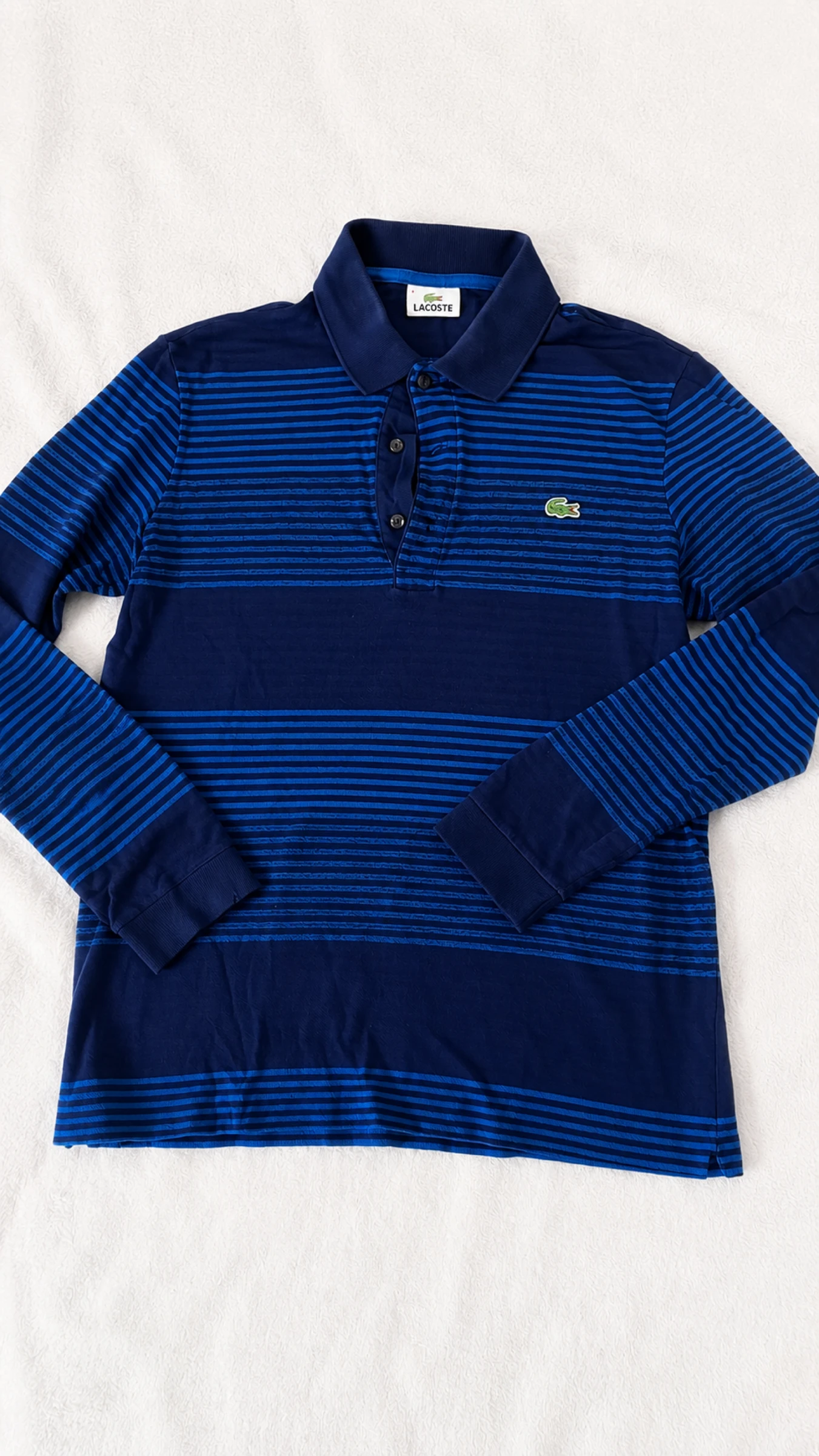 Polo Lacoste manches longues rayé bleu marine et bleu Taille S